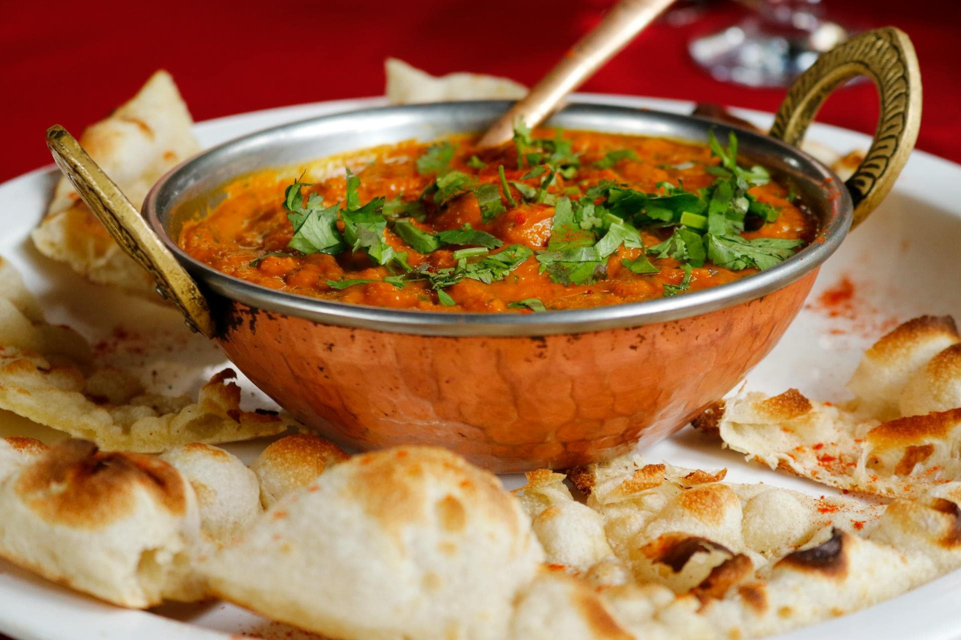 Vibrant Indian cuisine spread with naan and curries
